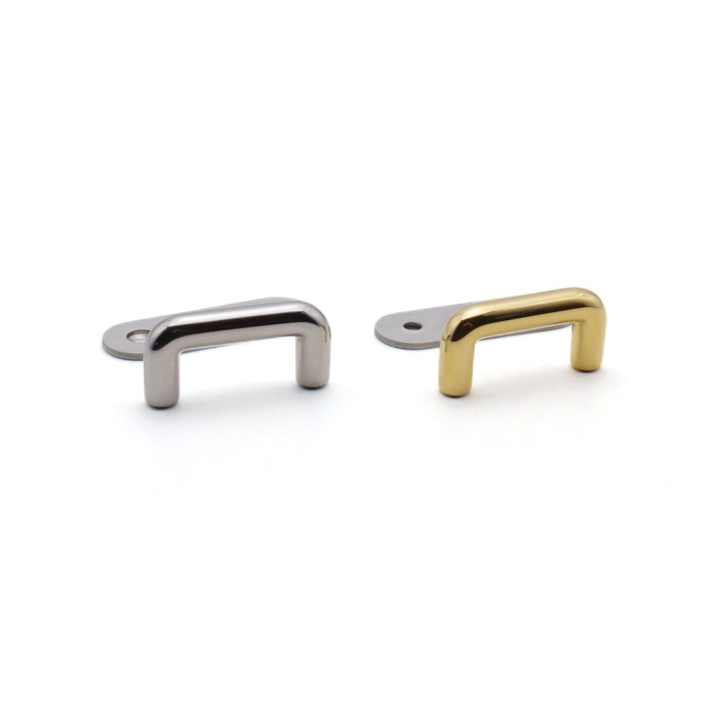 Bridge handle mount showing back plate and screw holes
