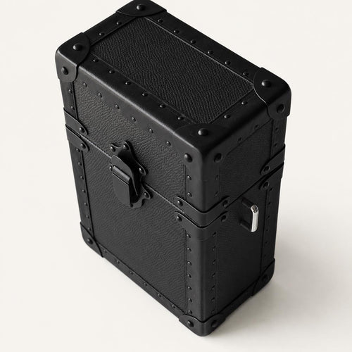 Leather-wrapped jewelry trunk with black finish and metal lock